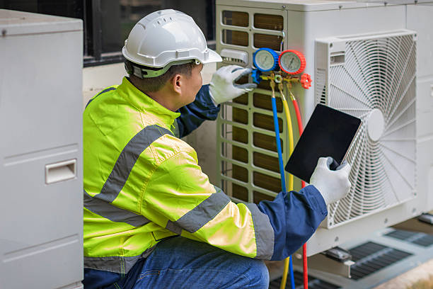 Professional Heat Pump Repair technician working in Harrisonville, MO